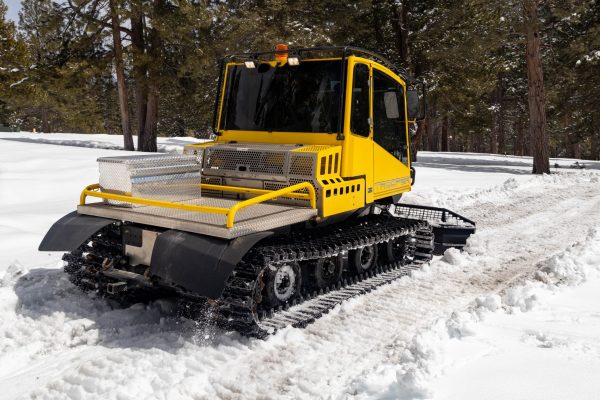 Ruberized tracks on the snowcat ensure the tracks are gentle on the course.